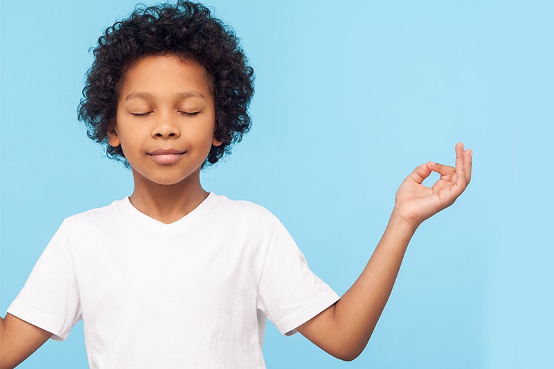 Boy practicing belly breathing