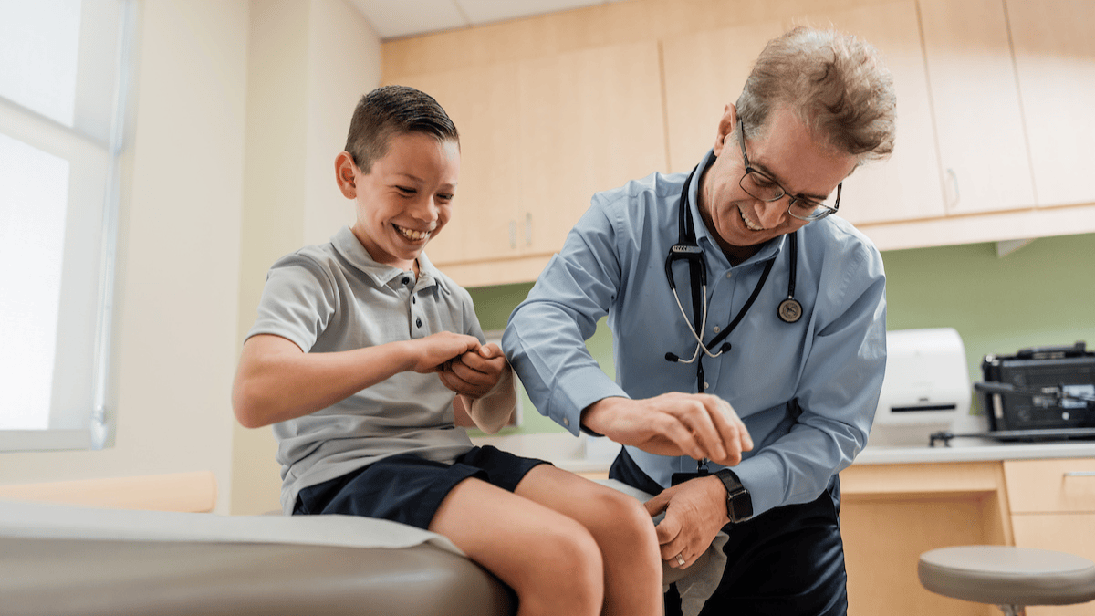 An endocrinologist examines a patient
