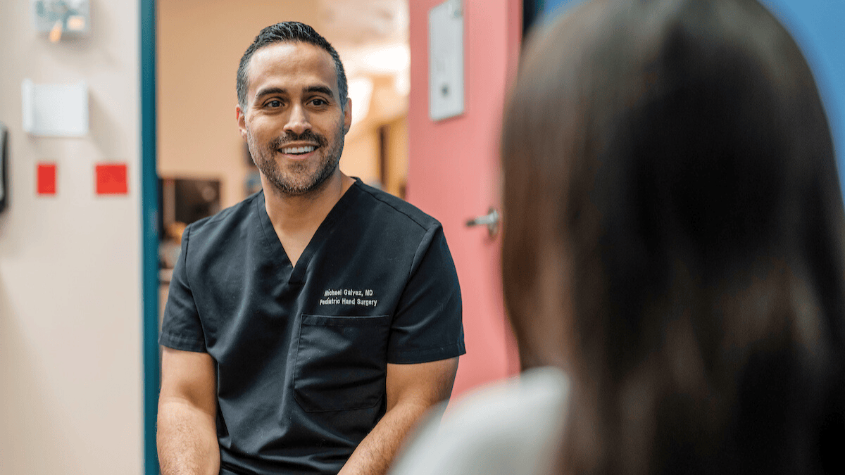 Dr. Michael Galvez consults with a patient