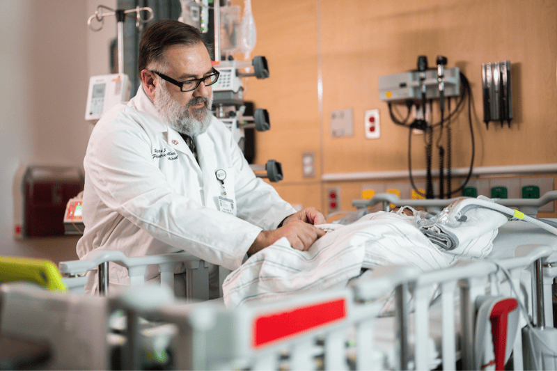 Dr. Harry Kallas attends to a patient