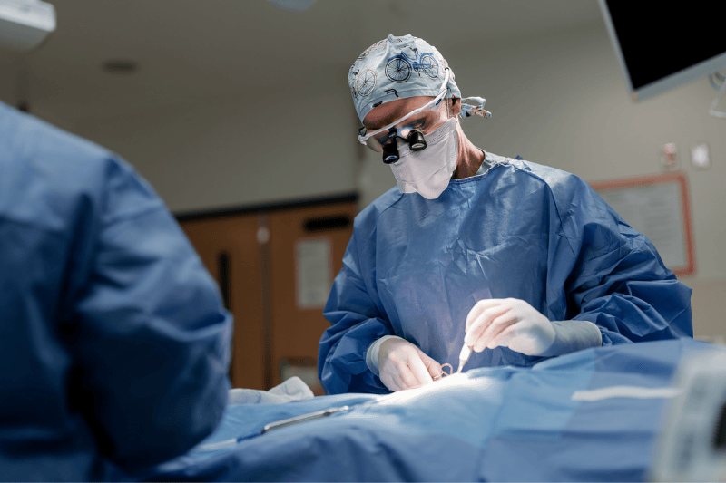 A surgeon operates