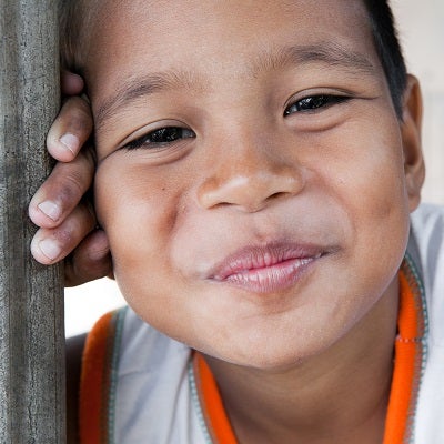 A young boy smiles