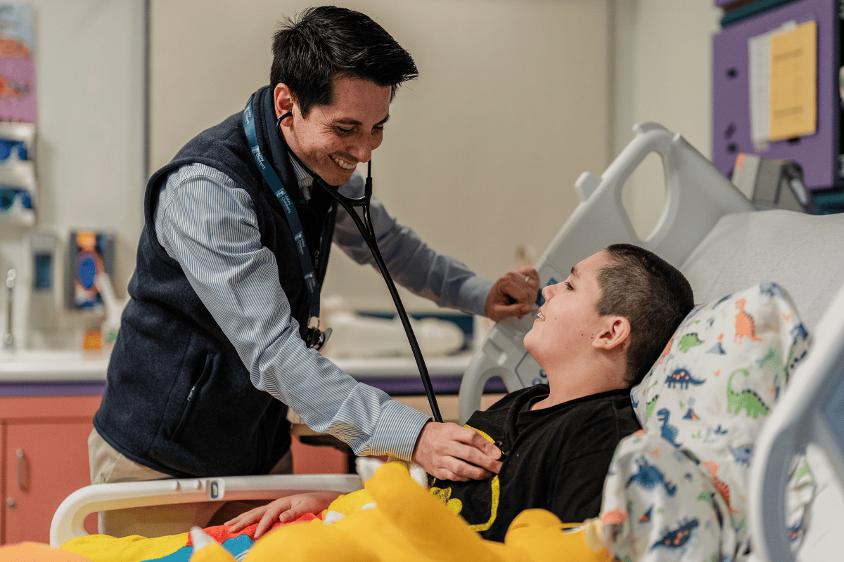 Dr. David Tomajan examines a patient