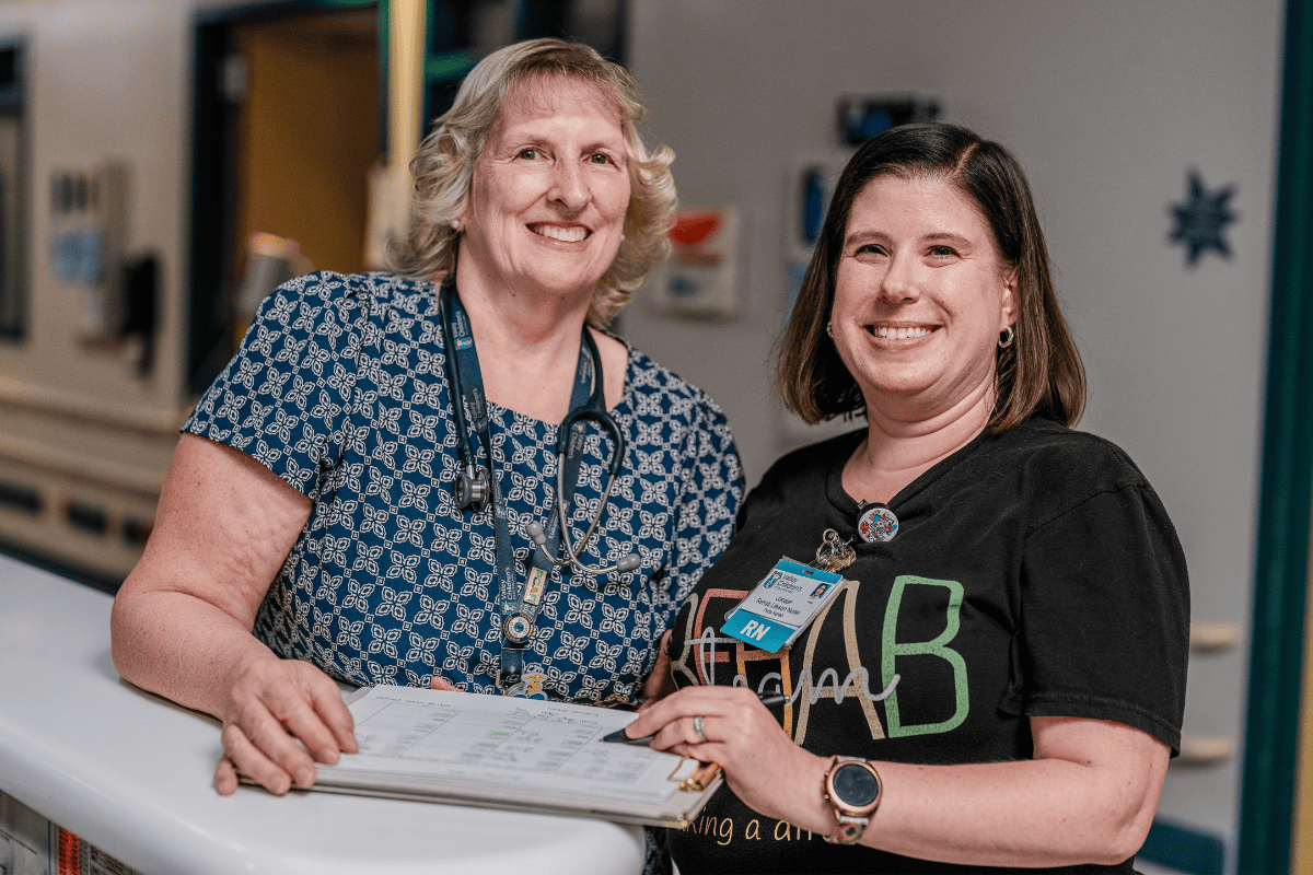 Two members of the Inpatient Rehabilitation Center team smile