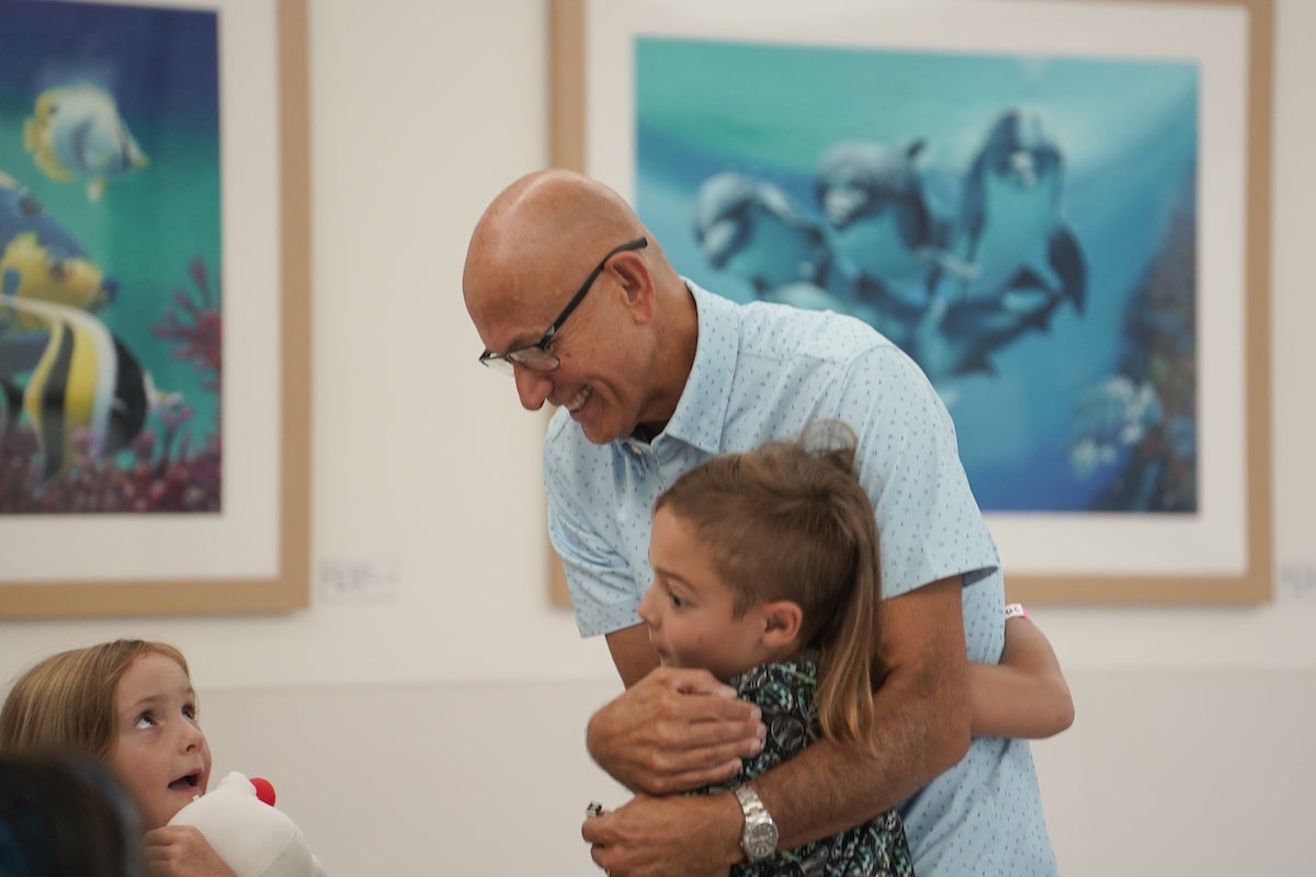 A child hugs a social a social worker