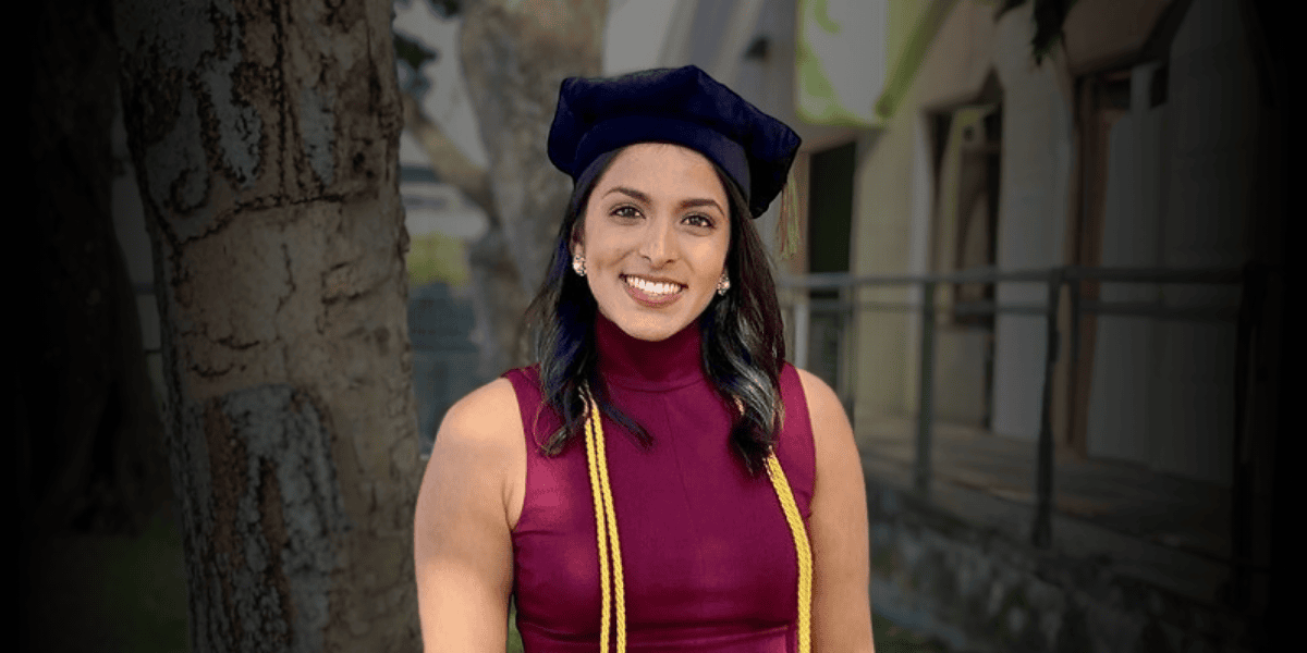 Photo of Binny smiling at graduation