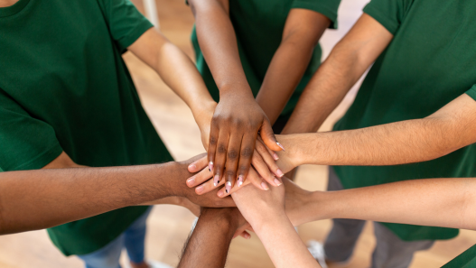 Hands coming together in a circle