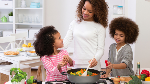 Mother cooking with daughter and son