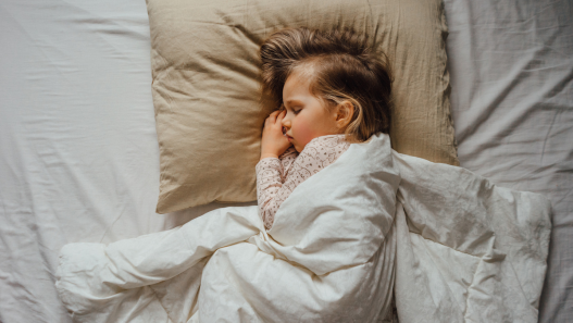 Child asleep in bed