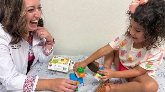 Dr. Hailey Nelson and Child Playing with Legos 