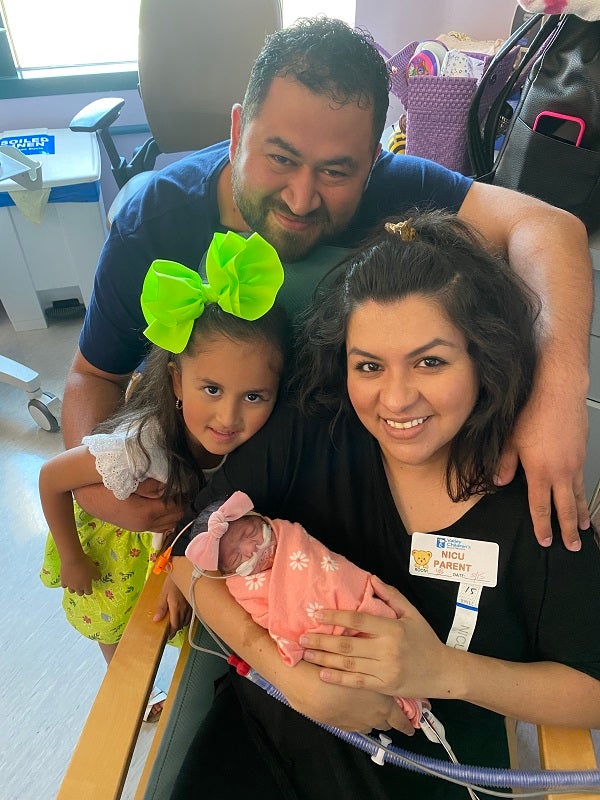 Mahria, her mom, dad, and sister are all smiles