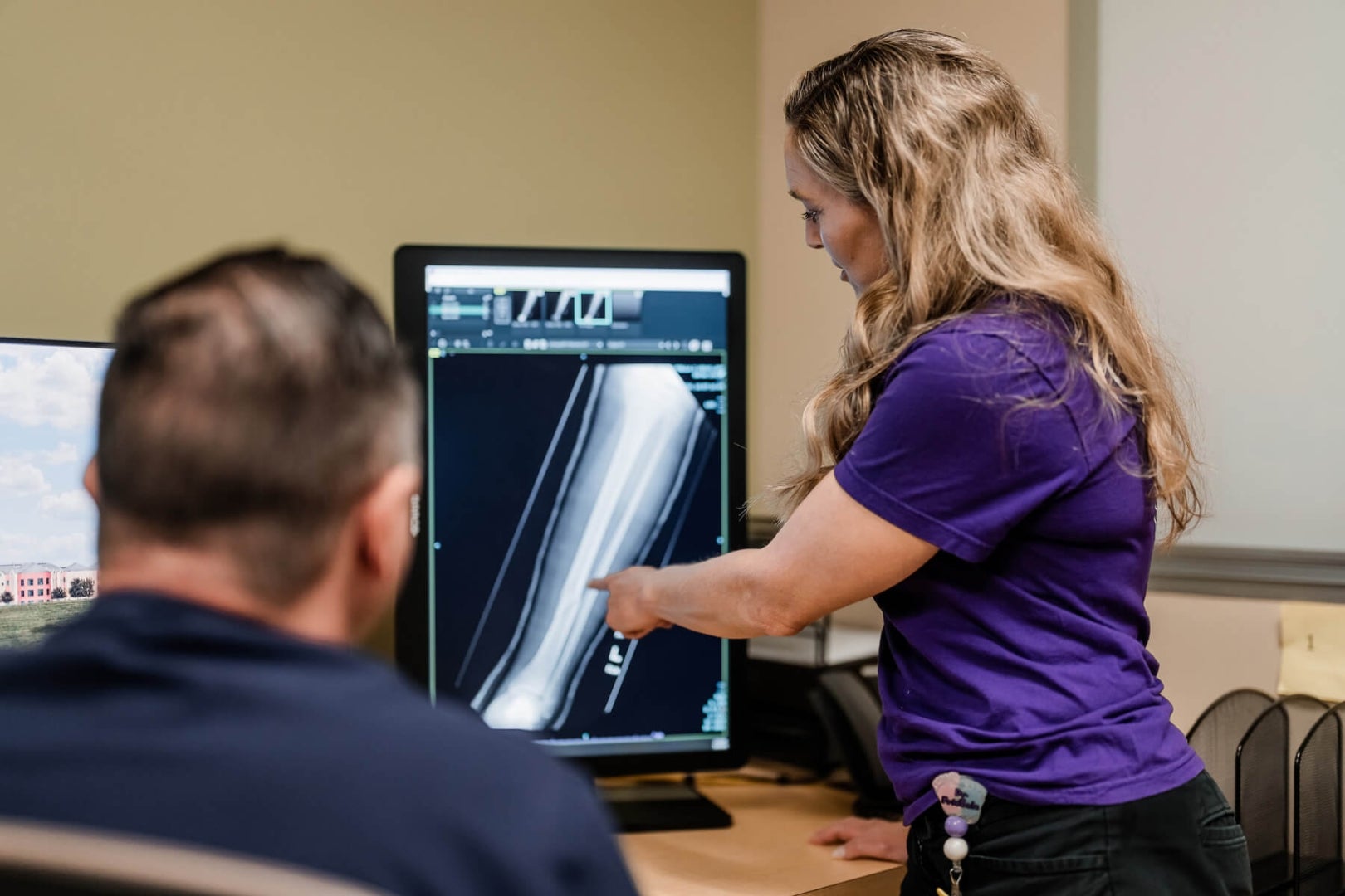 A physician reviews an X-ray